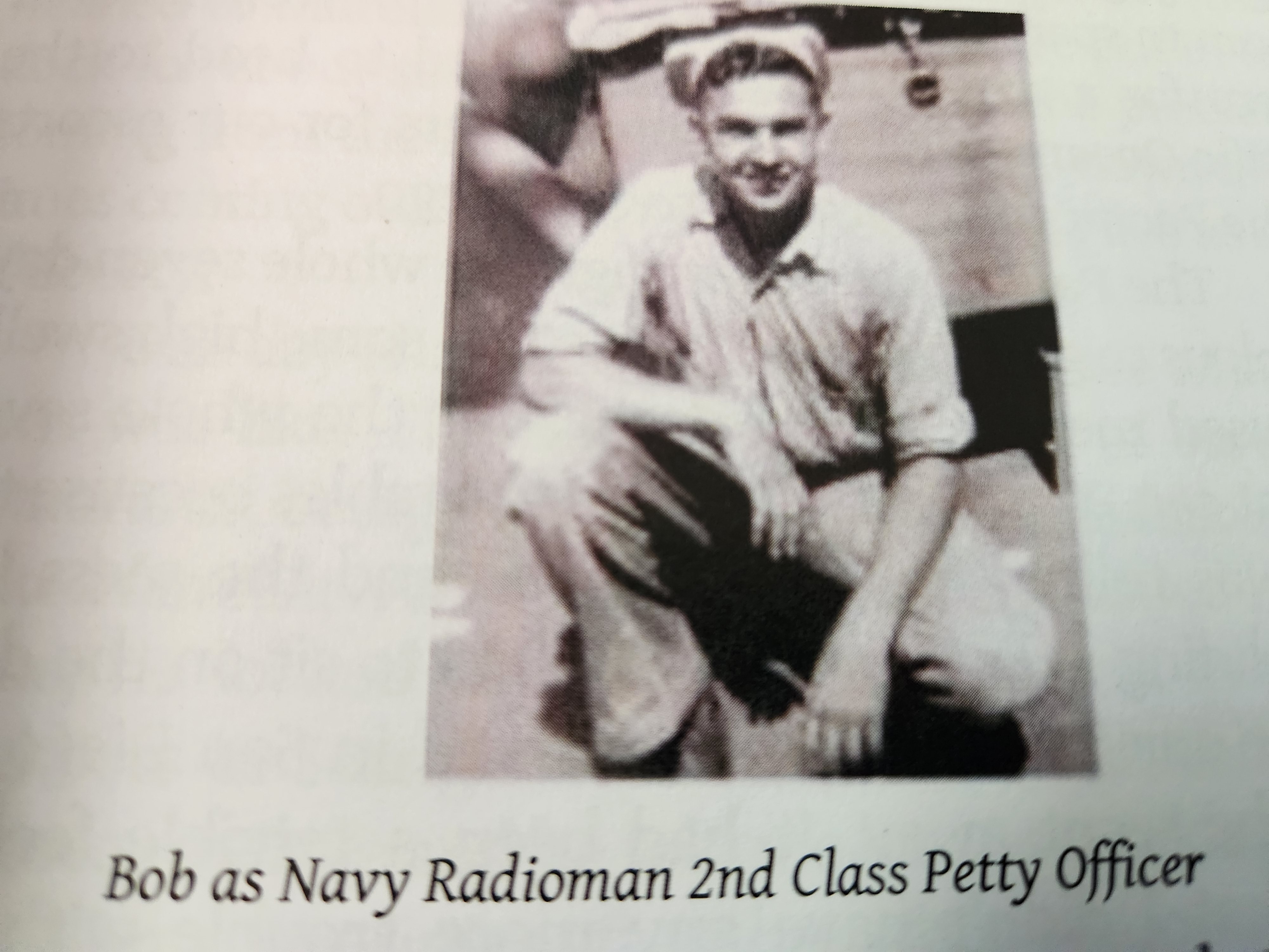 Black and white photo of Bob Persichitti that says "Bob as Navy Radioman 2nd Class Petty Officer."